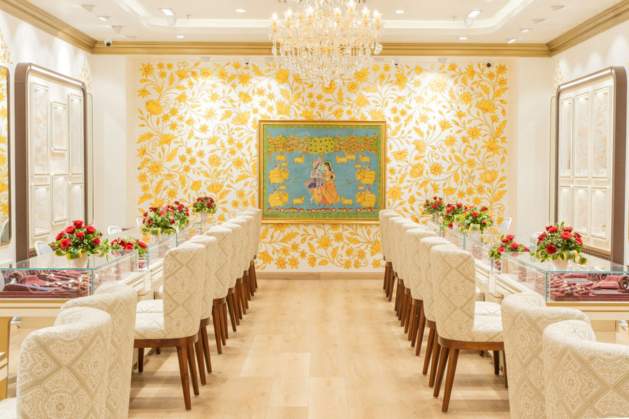 The hall of the Bilaspur store, its walls painted with golden flowers