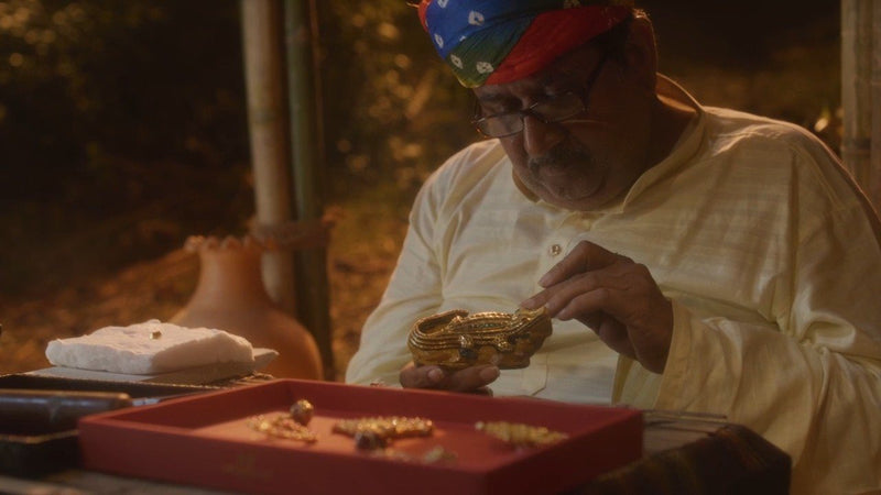 A master sonar looks over a finished gold bangle