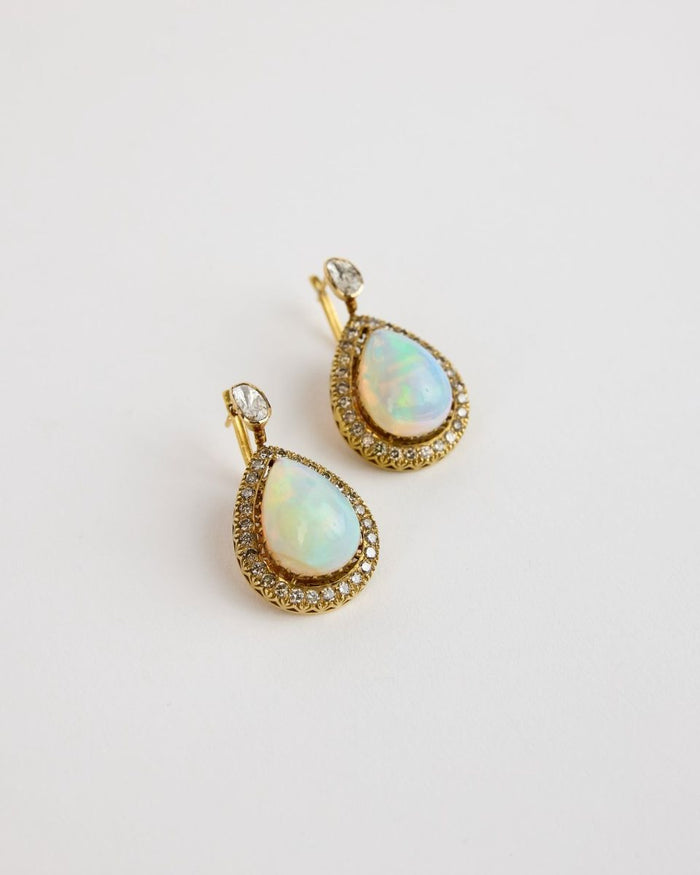 Earrings of opals framed in polki